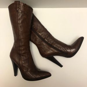 Western inspired pointed toe heel boots.